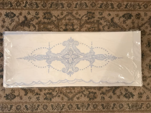 Vintage pillowcase with blue embroidery